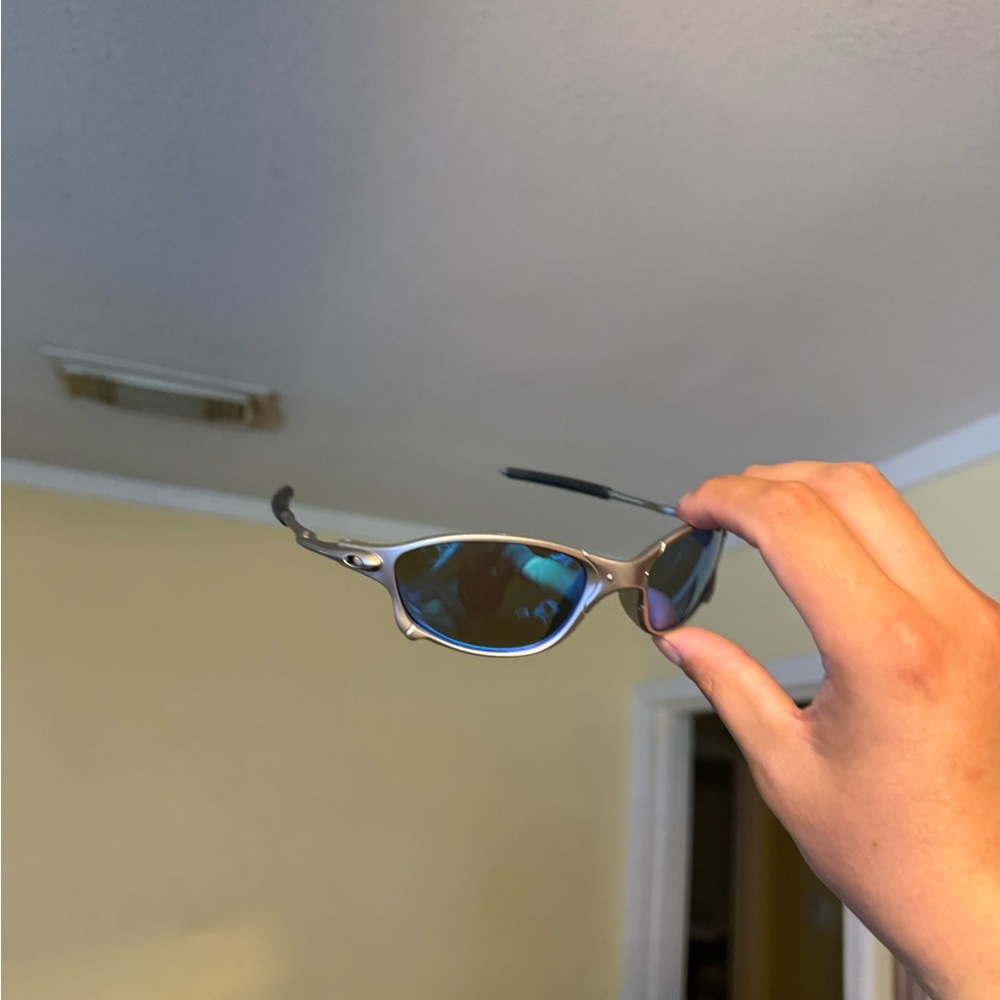 Sporty Titanium Sunglasses with Blue Mirrored Lenses Oakley Oakleys